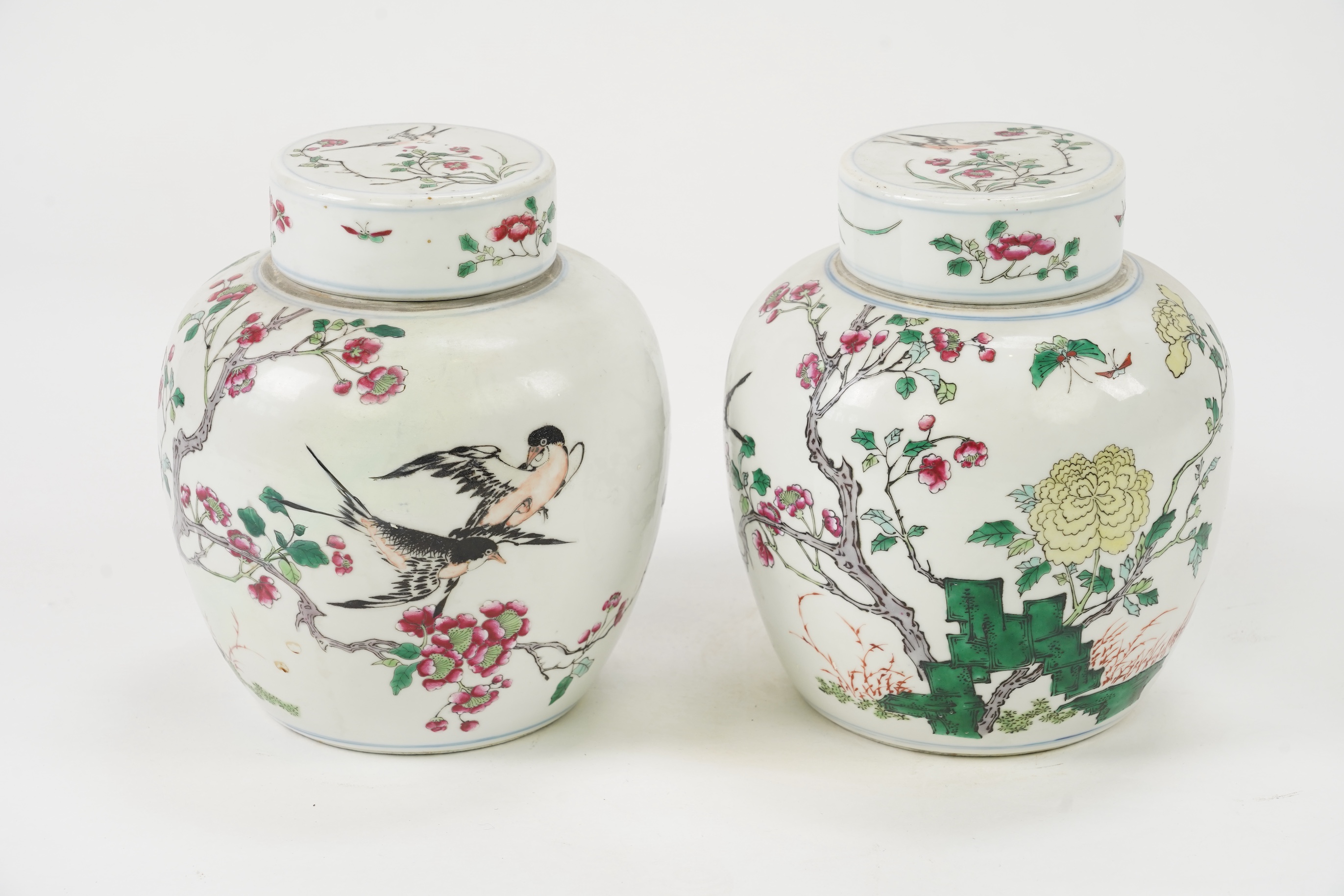 A pair of Chinese famille rose jars and covers, Kangxi mark but late 19th/early 20th century